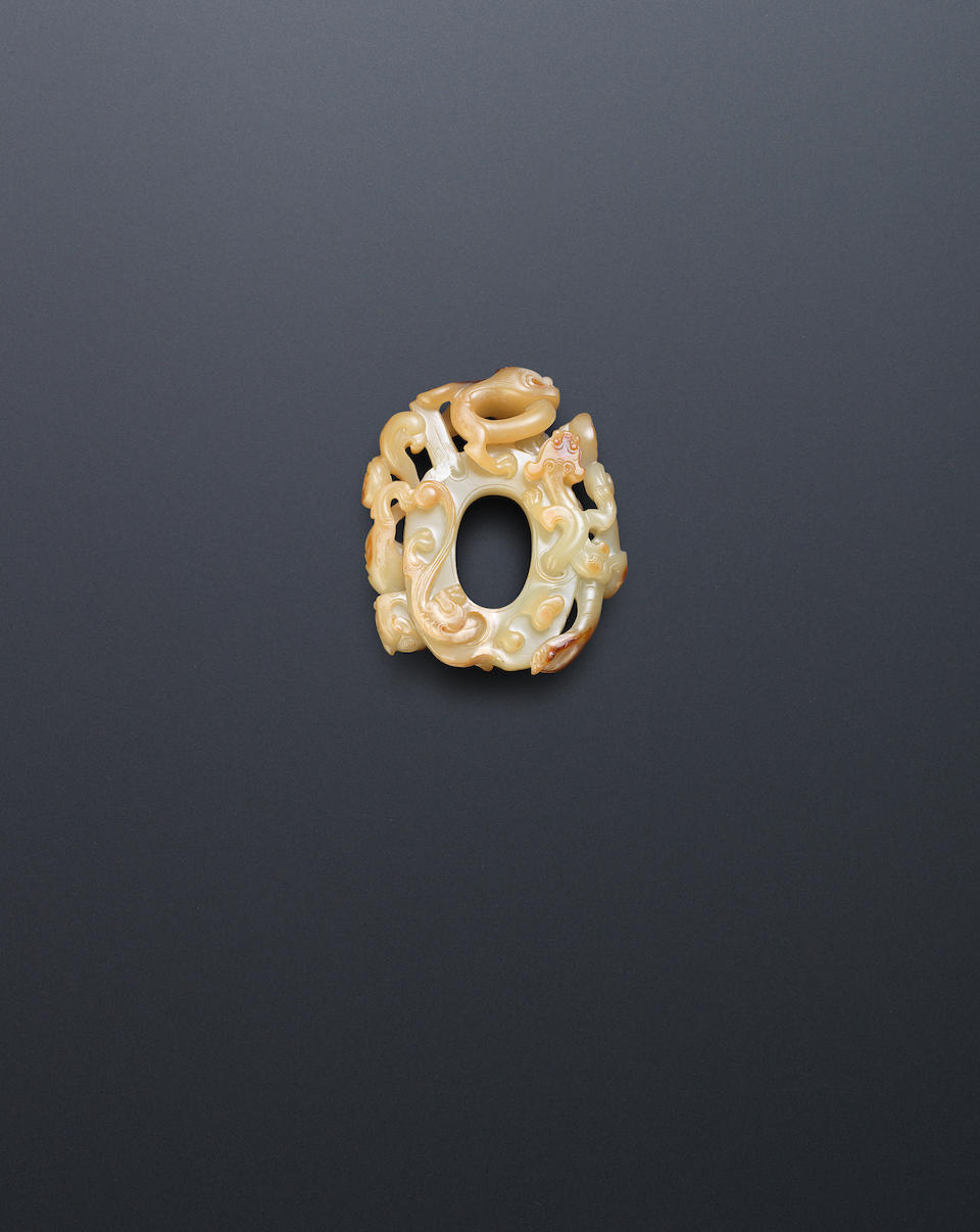 A yellow and russet jade archaistic 'chi dragon' disc, bi 17th/18th century