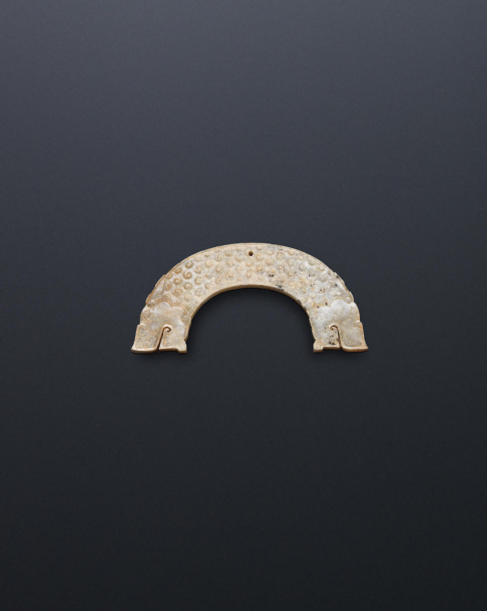 A jade plaque, huang; together with two jade sword fittings Warring States Period (3)