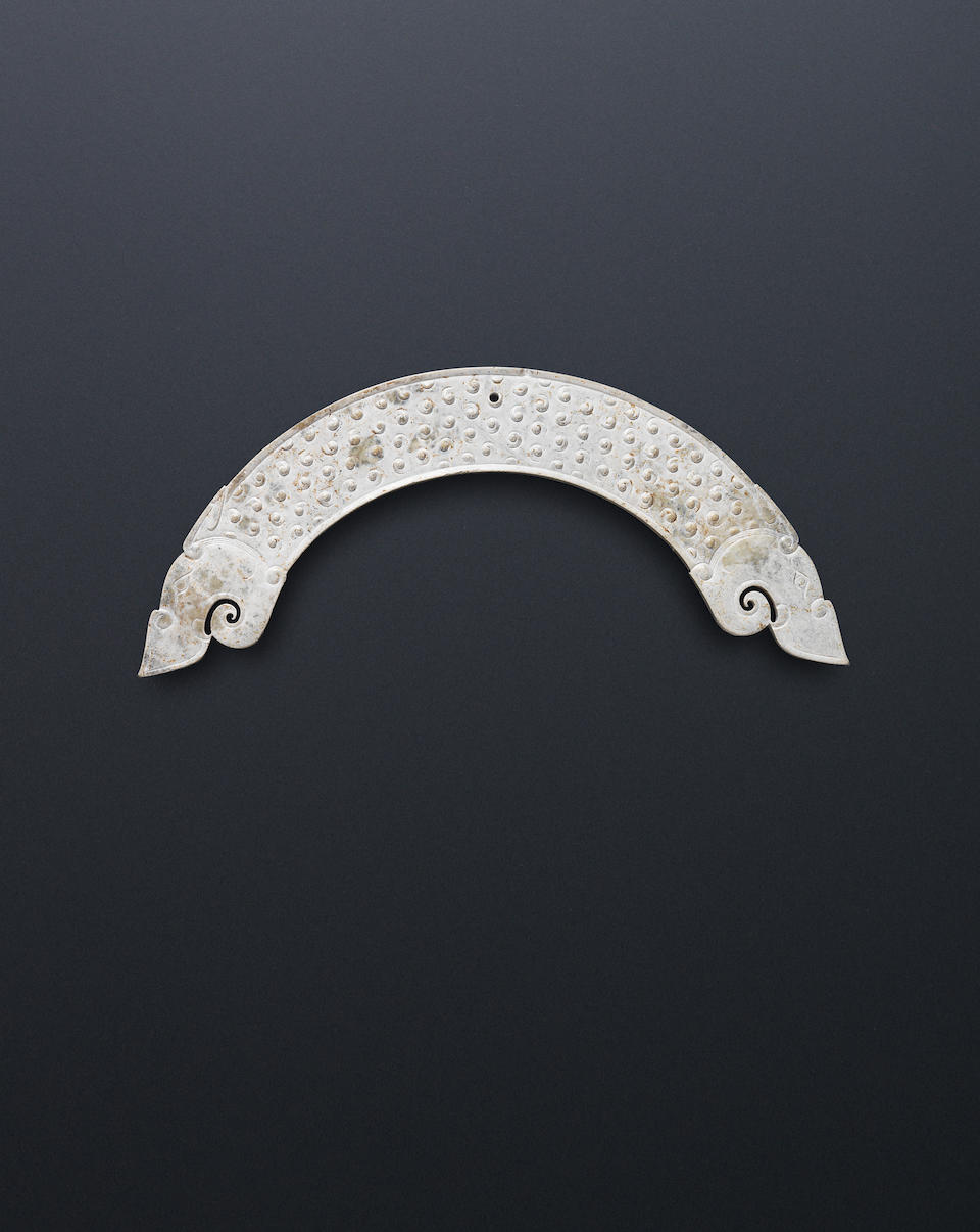 A calcified grey jade pendant, huang Warring States Period/Han Dynasty