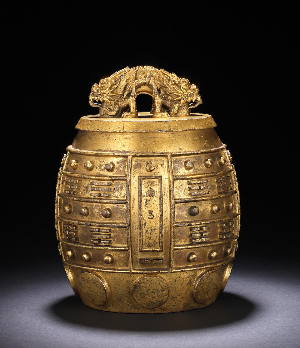 A rare Imperial gilt-bronze archaistic ritual bell, bianzhong Kangxi cast mark, dated to the 54th year corresponding to 1715 and of the period (2)