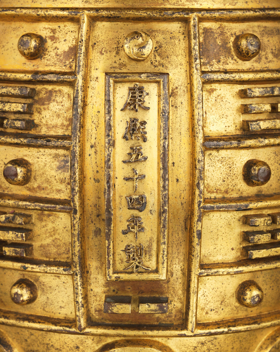 A rare Imperial gilt-bronze archaistic ritual bell, bianzhong Kangxi cast mark, dated to the 54th year corresponding to 1715 and of the period (2)