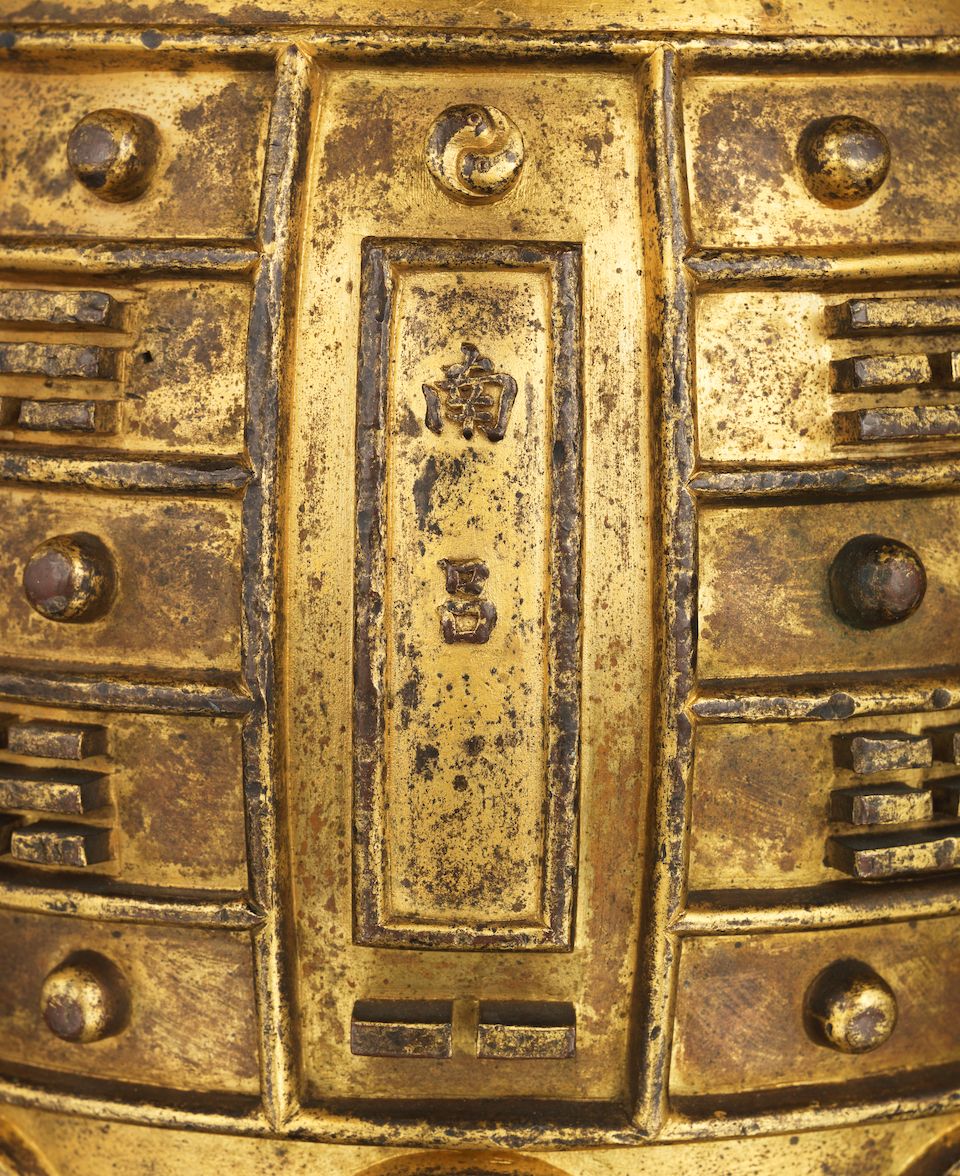A rare Imperial gilt-bronze archaistic ritual bell, bianzhong Kangxi cast mark, dated to the 54th year corresponding to 1715 and of the period (2)