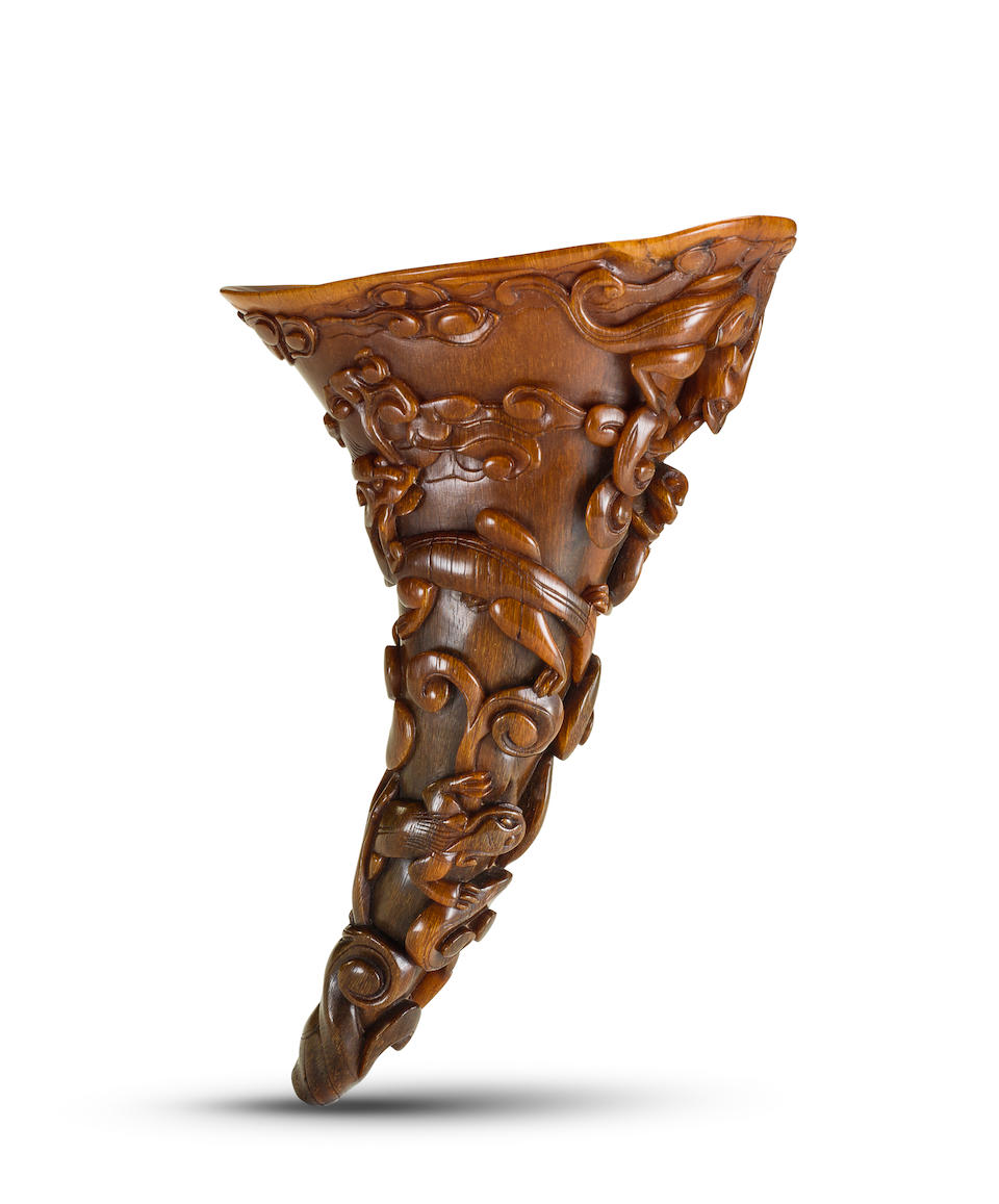A carved 'chi dragon and clouds' rhinoceros horn libation cup 17th century