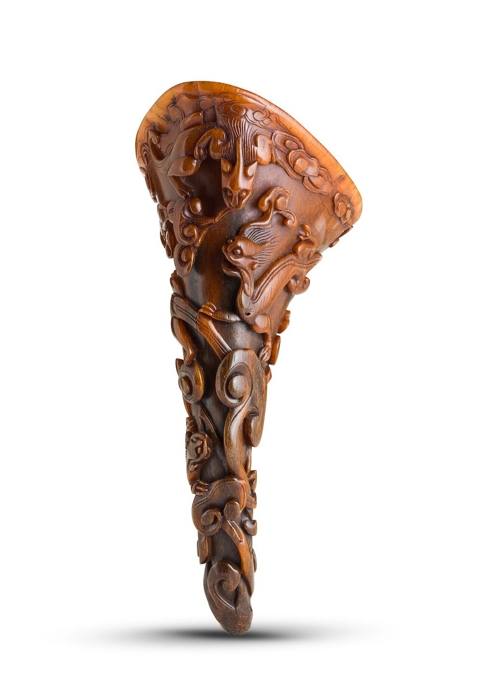 A carved 'chi dragon and clouds' rhinoceros horn libation cup 17th century