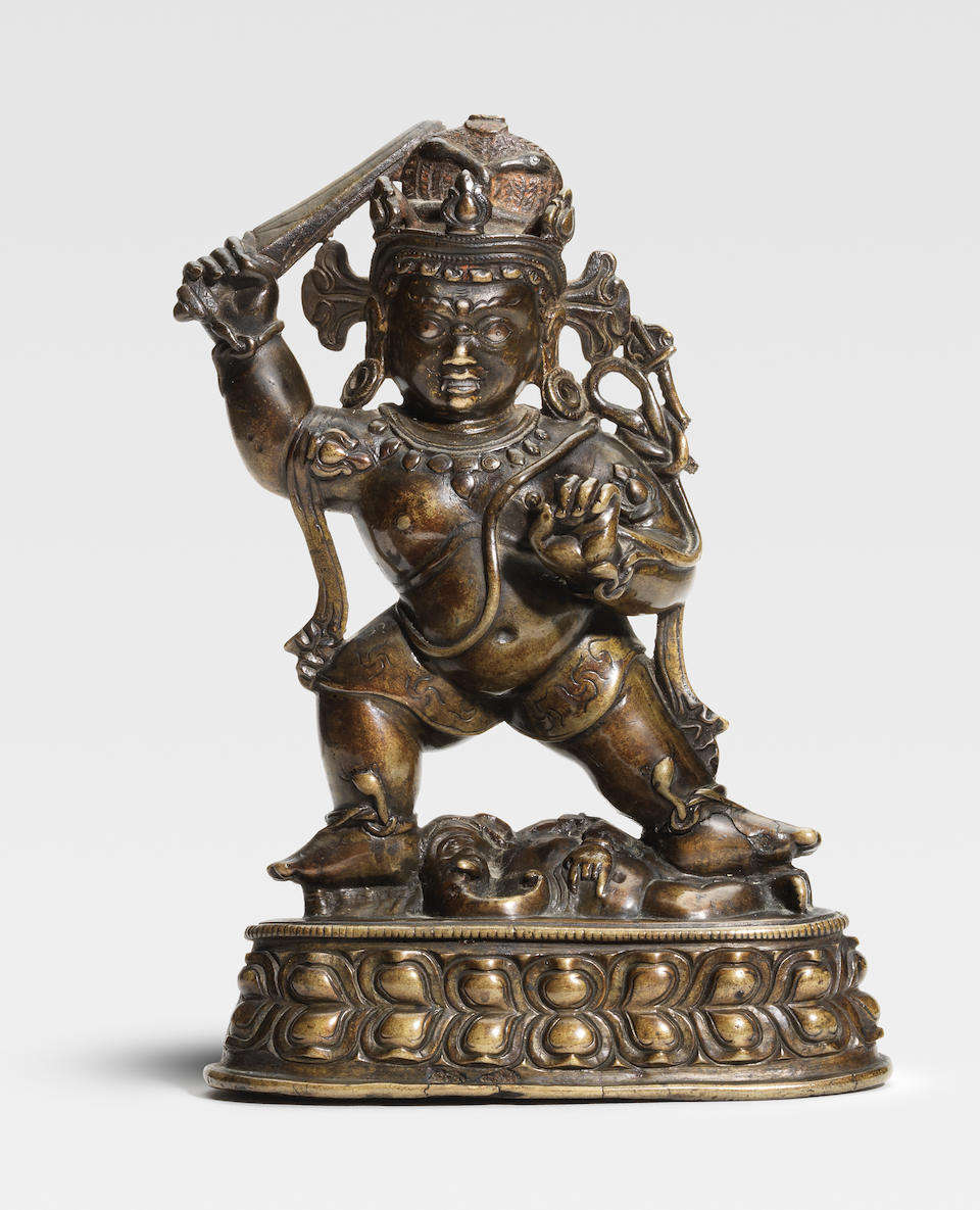 A COPPER AND SILVER INLAID COPPER ALLOY FIGURE OF ACALA TIBET, 13TH CENTURY