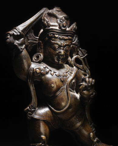 A COPPER AND SILVER INLAID COPPER ALLOY FIGURE OF ACALA TIBET, 13TH CENTURY