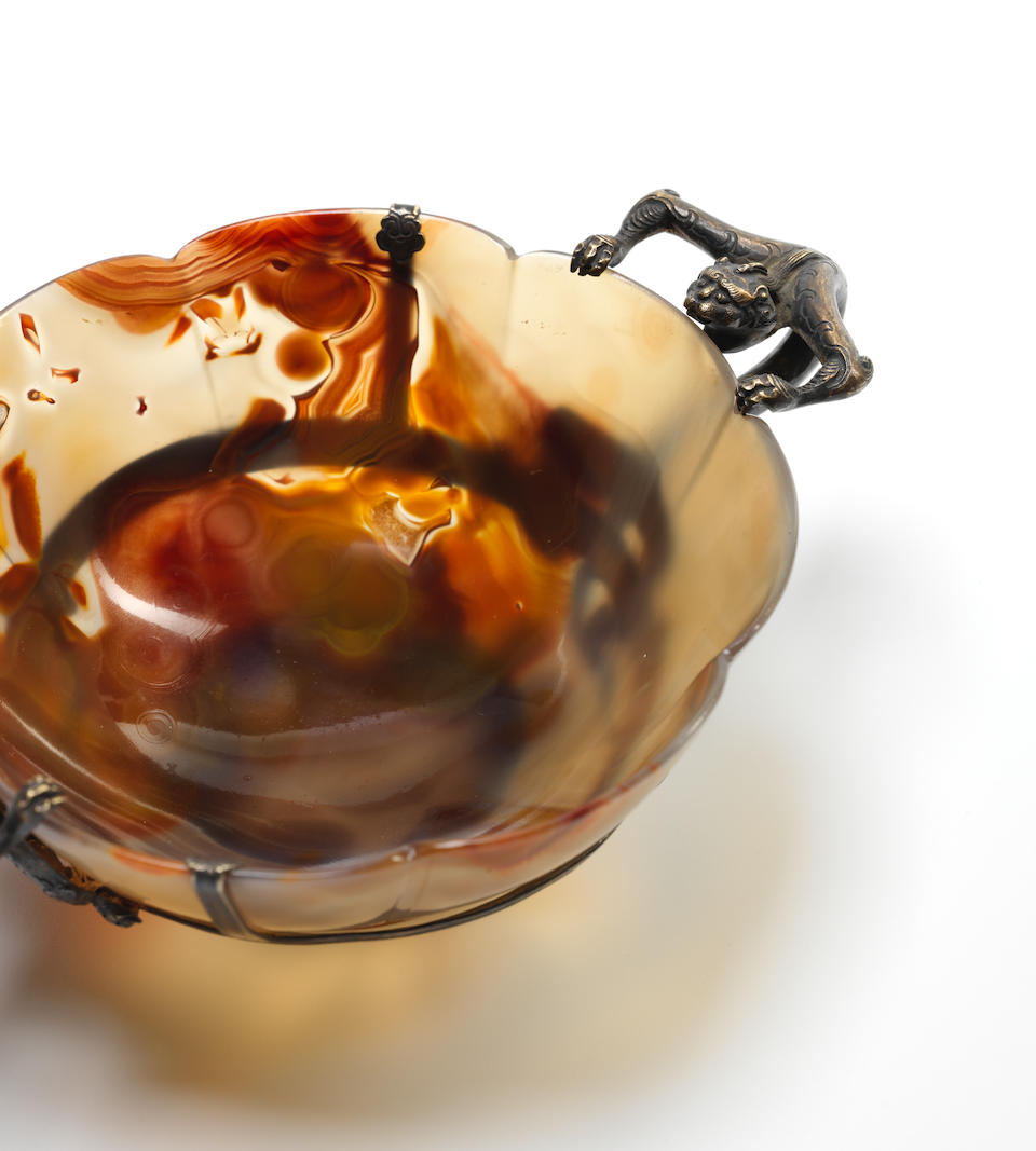 A very rare agate lobed 'mallow' bowl The bowl Song Dynasty or later; the silver mounts possibly 16th/17th century