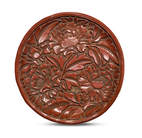 A rare carved cinnabar lacquer 'peony' dish  Second half 14th century (3)