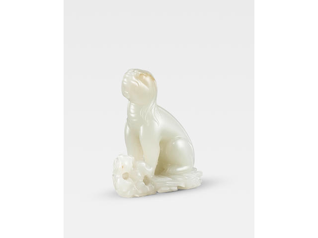 An exceptional white jade carving of a seated mythical beast Song/Ming Dynasty