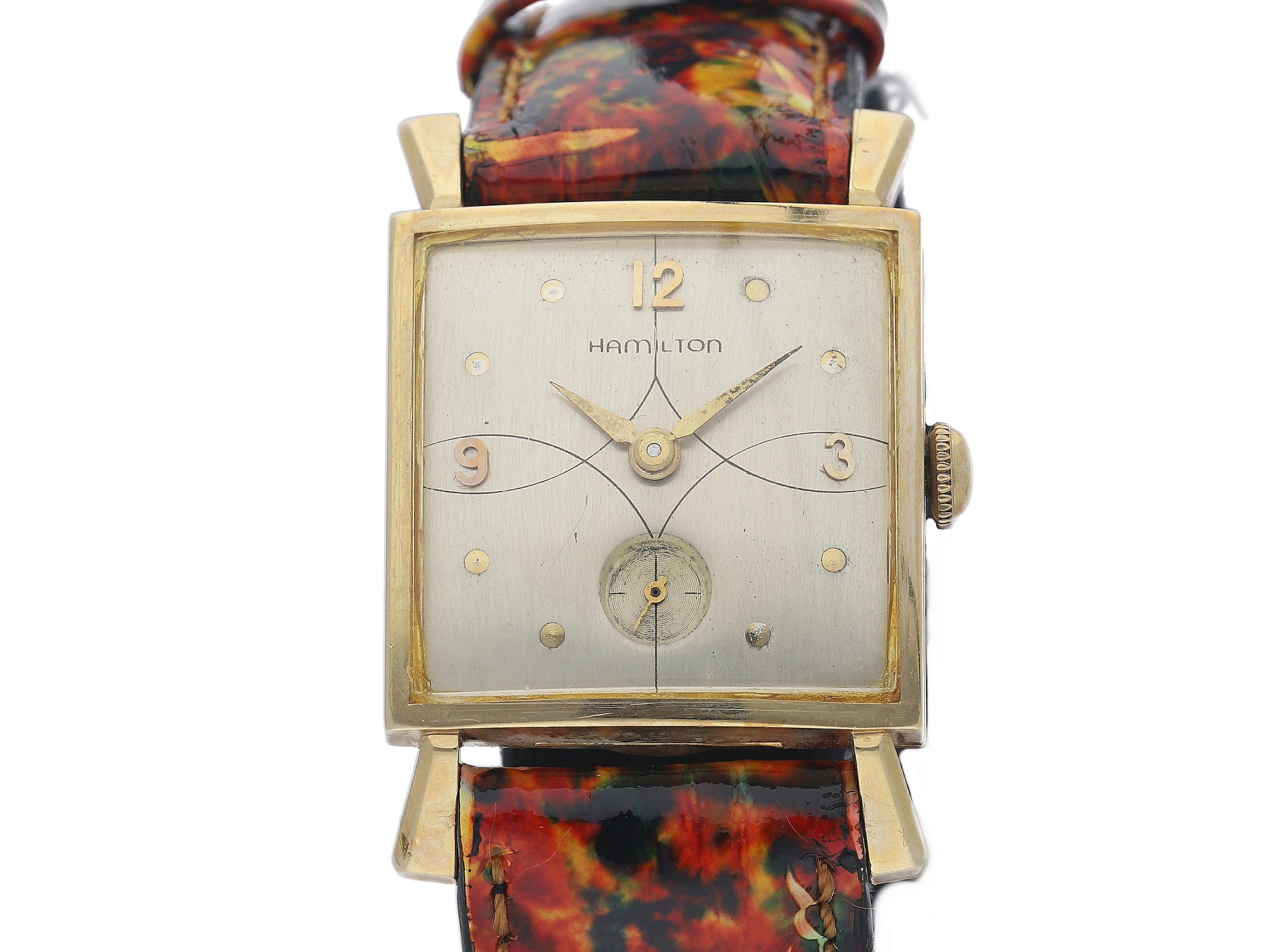 Hamilton. A 14K Yellow Gold Square Wristwatch with Fancy Lugs