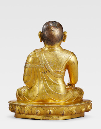 Bonhams A GILT COPPER ALLOY FIGURE OF THE SIXTH ABBOT OF DRIGUNG