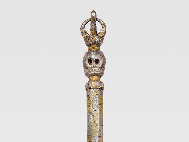 A GOLD AND SILVER DAMASCENED IRON KAPALA DANDA DERGE, EASTERN TIBET, 15TH CENTURY