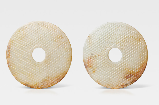 A very rare pair of large white and russet jade discs, bi Late Warring States/mid Western Han Dynasty (3) image 1