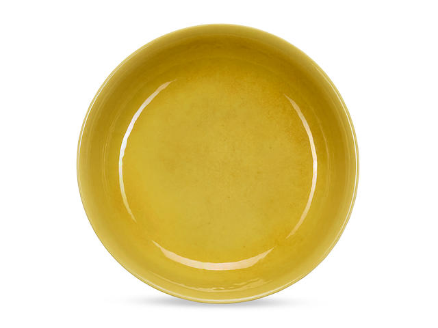 A very rare yellow-glazed anhua 'dragon' saucer-dish Late Tianshun/early Chenghua