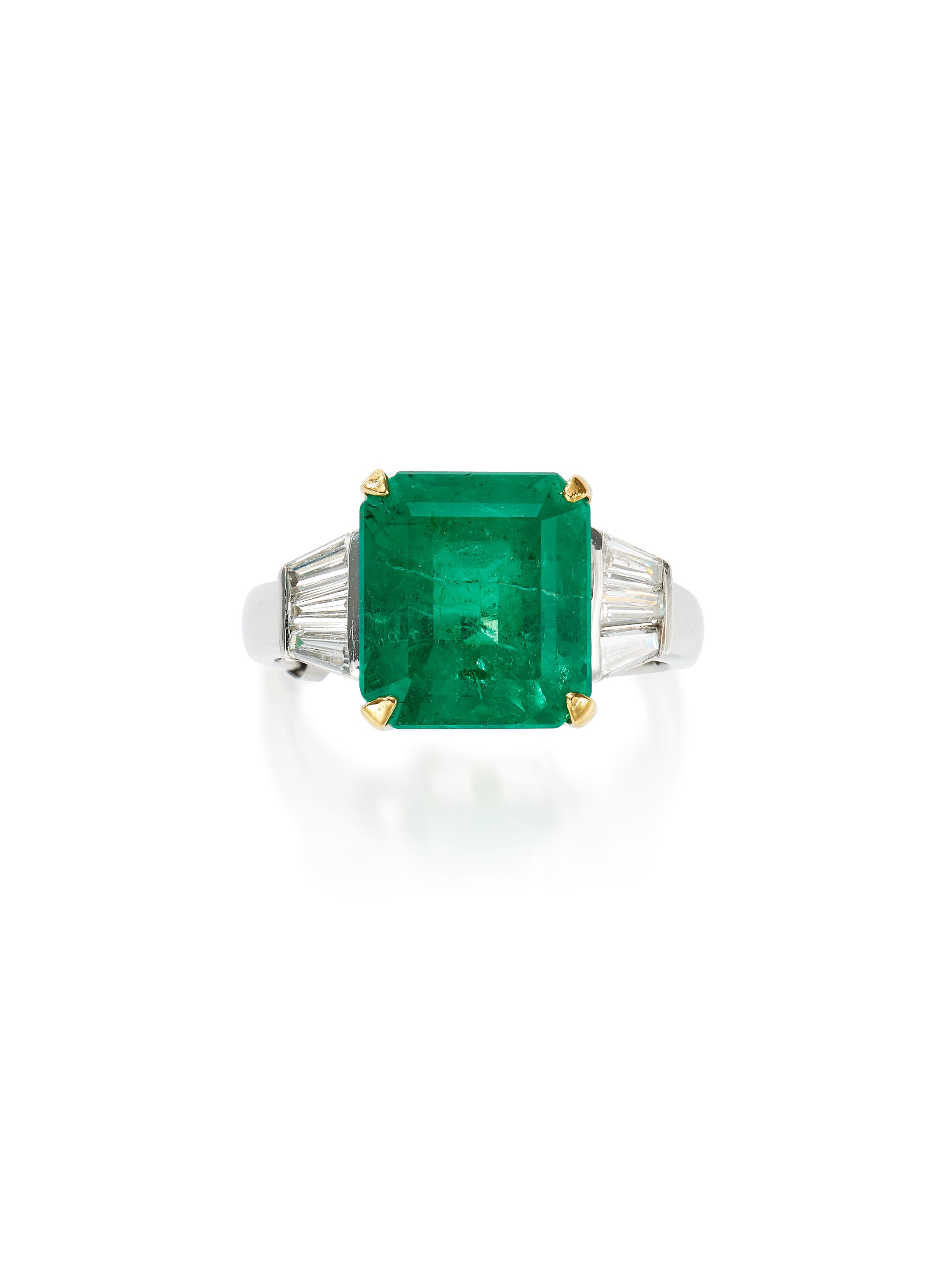 AN EMERALD AND DIAMOND RING