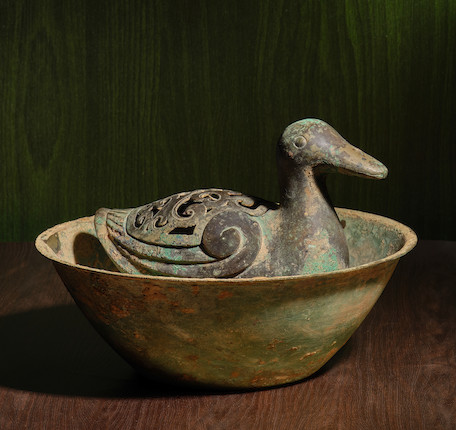 A RARE ARCHAIC BRONZE 'DUCK' INCENSE BURNER AND COVER WITHIN A BOWL Mid Western Han Dynasty image 1