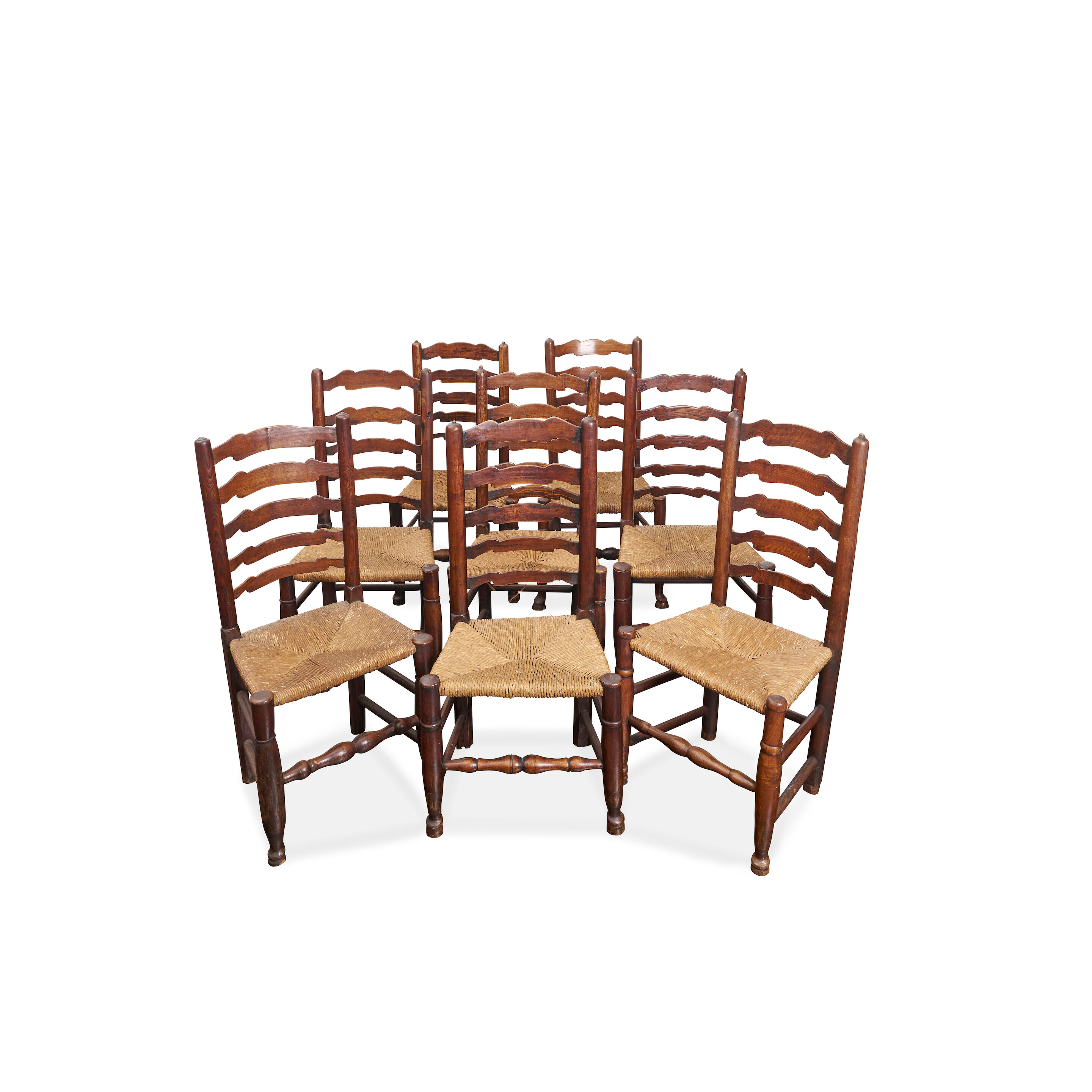 A matched set of ten ladder-back dining chairs