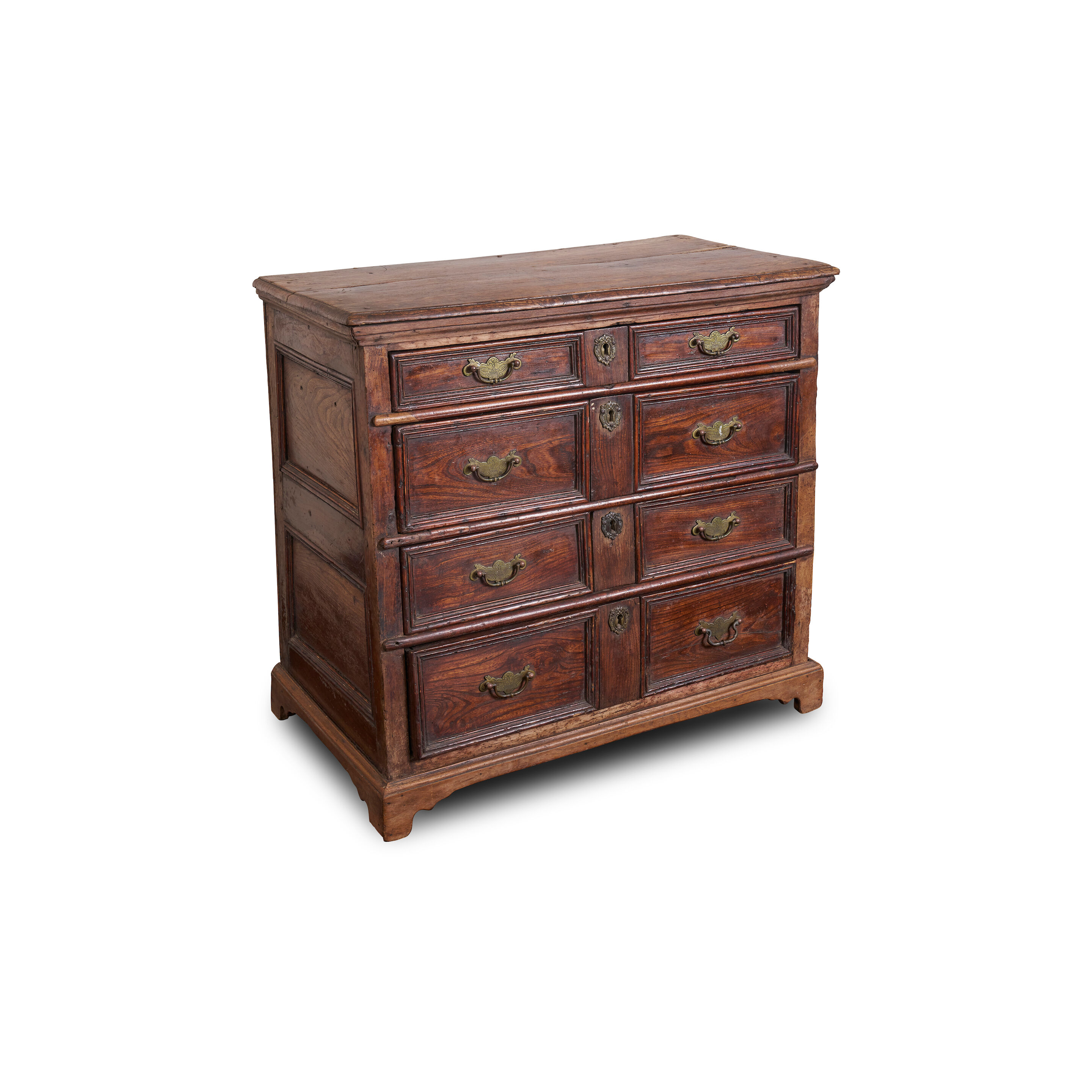 An English elm chest of drawers, late 17th/ early 18th century,