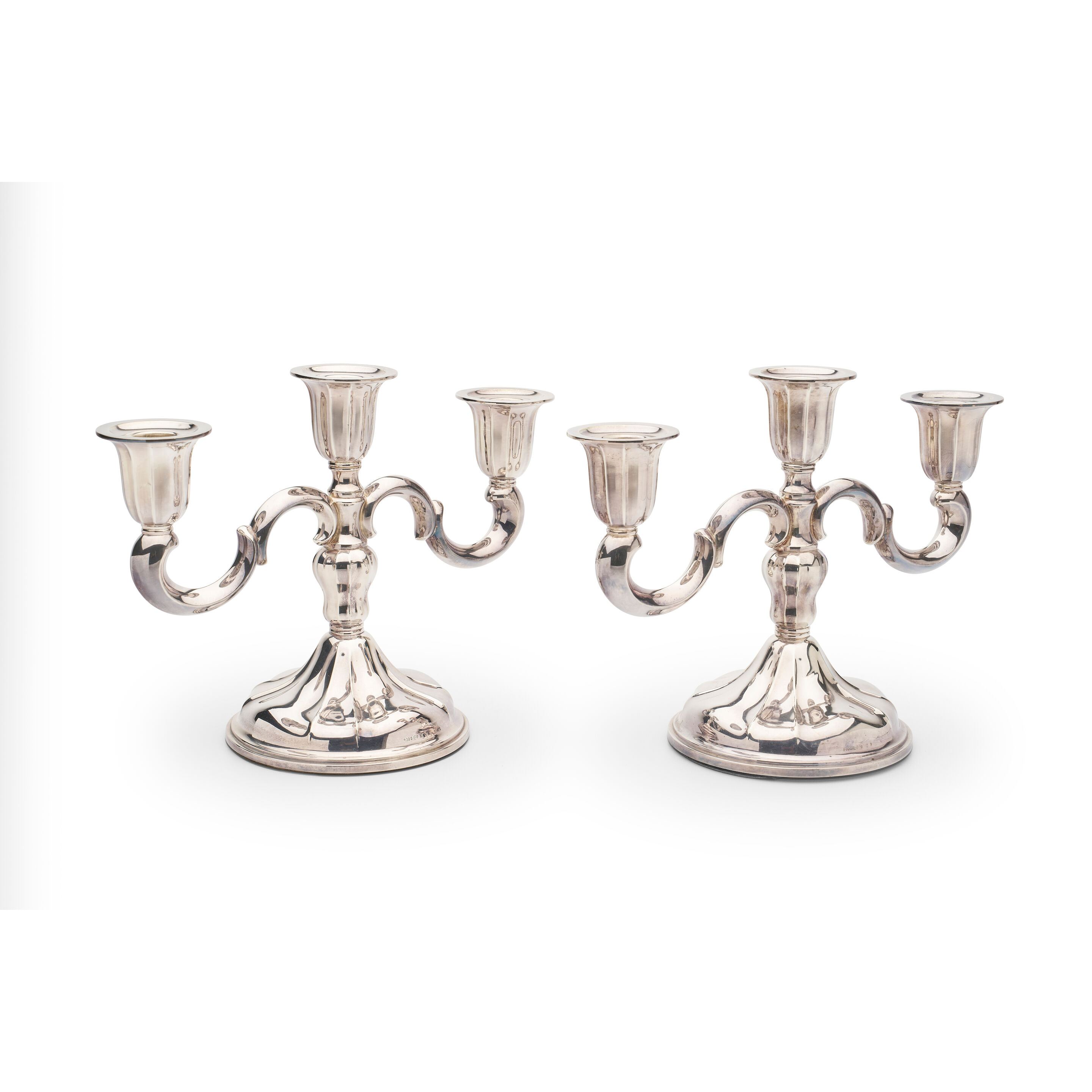 A pair of Scandanavian silver three-branch candelabra