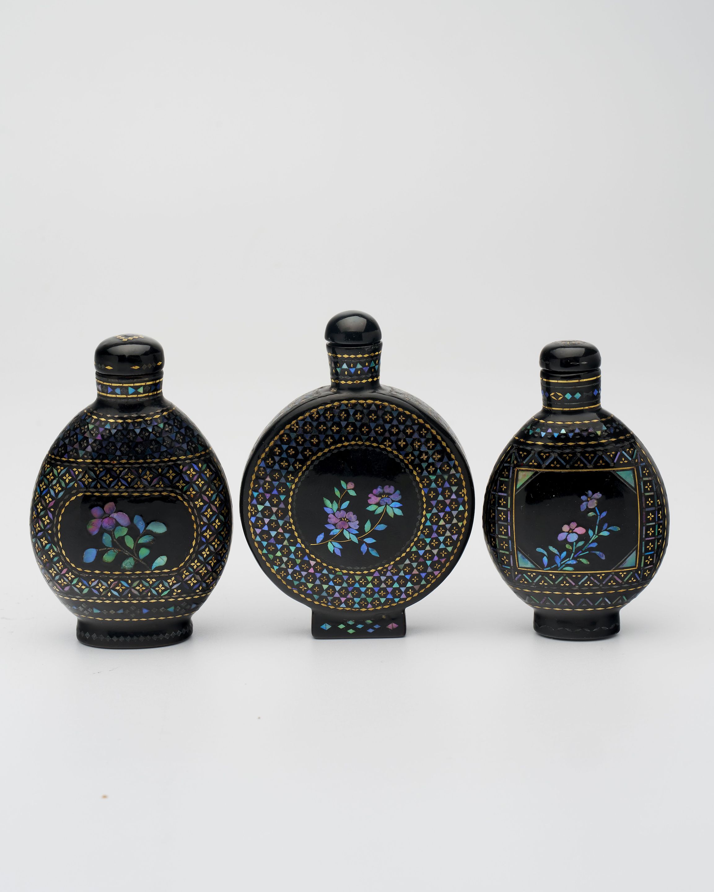 THREE LAC BURGAUTE SNUFF BOTTLES One of Qianli mark, 19th century