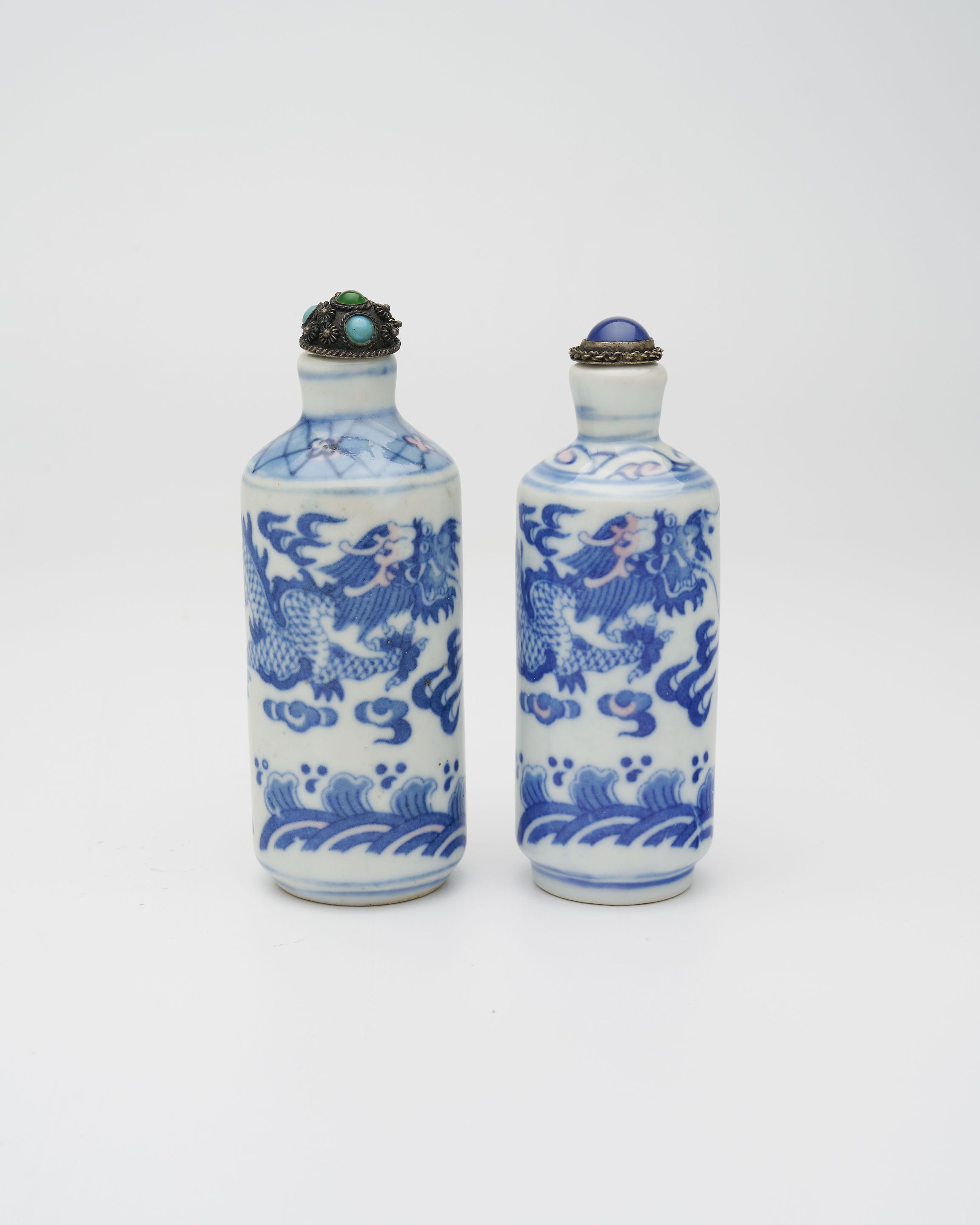 TWO UNDERGLAZE-BLUE AND COPPER-RED SNUFF BOTTLES Kangxi and Qianlong marks, mid 20th century