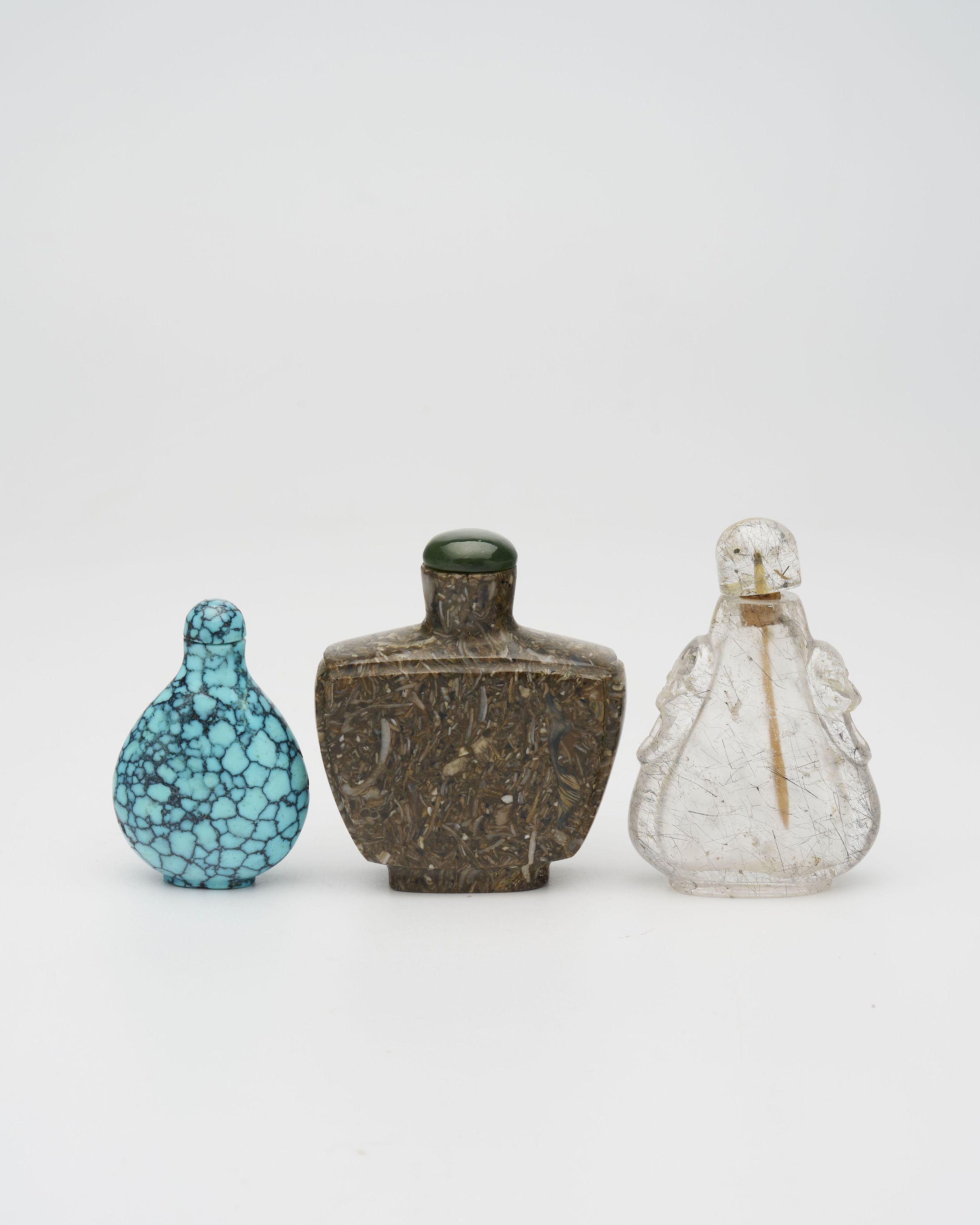 A PUDDINGSTONE, A TURQUOISE, AND A ROCK CRYSTAL SNUFF BOTTLE 19th/20th century