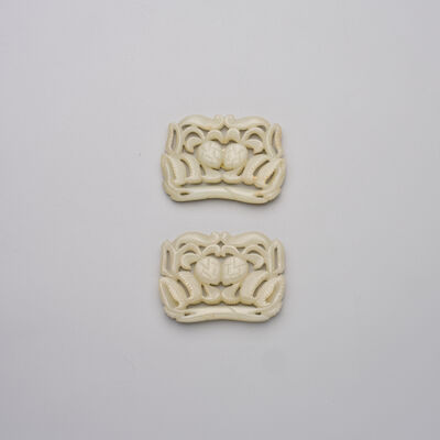 A PAIR OF GREYISH JADE 'LYCHEE' PLAQUES 19th/20th century (2)