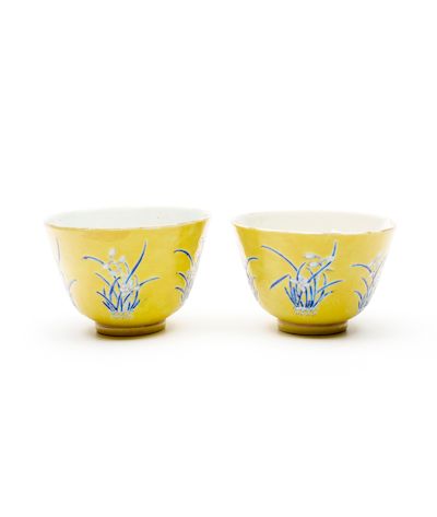 A PAIR OF YELLOW-GROUND BLUE ENAMELLED 'NARCISSUS' CUPS Tongzhi four-character marks and of the period (3)